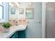 Charming bathroom with colorful vintage vanity, bright lighting, and well-maintained fixtures at 731 44Th Ne Ave, St Petersburg, FL 33703