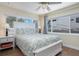 Bright bedroom featuring a bed, ample natural light and hardwood flooring with modern ceiling fan at 731 44Th Ne Ave, St Petersburg, FL 33703
