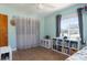 Bright, airy bedroom with hardwood flooring, built-in shelving, and neutral decor creating a welcoming space at 731 44Th Ne Ave, St Petersburg, FL 33703