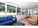 Spacious Florida room offers a seamless transition to outdoor living and beautiful backyard views at 731 44Th Ne Ave, St Petersburg, FL 33703