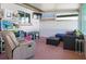 Enclosed lanai provides versatile space with seating, storage, and entertainment options for relaxation at 731 44Th Ne Ave, St Petersburg, FL 33703