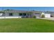 Charming single-story home with a well-maintained lawn and lovely curb appeal on a sunny day at 731 44Th Ne Ave, St Petersburg, FL 33703