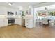 Bright kitchen featuring white cabinets, stainless steel appliances, and views into the dining area at 731 44Th Ne Ave, St Petersburg, FL 33703