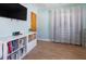 Comfortable living area featuring wood-look tile flooring and white shelving for ample storage at 731 44Th Ne Ave, St Petersburg, FL 33703