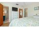 Comfortable bedroom with neutral colors, hardwood flooring, and ample closet space, adjoined by a bathroom at 731 44Th Ne Ave, St Petersburg, FL 33703