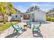 A cozy backyard featuring an outdoor bar, seating area, and fire pit at 747 39Th Ne Ave, St Petersburg, FL 33703