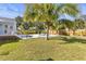 Landscaped backyard with lush lawn and lounge seating; perfect for outdoor living at 747 39Th Ne Ave, St Petersburg, FL 33703