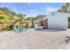 A spacious backyard features pea gravel, a seating area and a custom built outdoor bar at 747 39Th Ne Ave, St Petersburg, FL 33703