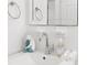 Modern bathroom sink with chrome fixtures, mermaid decor, and pristine white towels at 747 39Th Ne Ave, St Petersburg, FL 33703