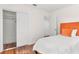 A simple bedroom featuring a full closet and an orange headboard at 747 39Th Ne Ave, St Petersburg, FL 33703