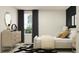 Sophisticated bedroom with a stylish bed, contemporary dresser, and a window offering natural light at 8108 Painted Sky Pl, Land O Lakes, FL 34637