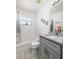 Bright bathroom featuring a shower/tub combo, neutral paint, and granite countertops at 9409 Sun Isle Ne Dr, St Petersburg, FL 33702