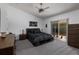 Bright bedroom with vaulted ceiling, soft carpet, sliding doors to the patio, and elegant furnishings at 9409 Sun Isle Ne Dr, St Petersburg, FL 33702