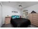 Comfortable bedroom with carpeted floors and ceiling fan at 9409 Sun Isle Ne Dr, St Petersburg, FL 33702