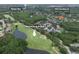 Aerial view of 9905 Woodbay Dr, a four-bed, three-bath pool home near Westchase Golf Club at 9905 Woodbay Dr, Tampa, FL 33626