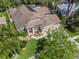Aerial view of home highlighting its landscaping, solar panels and well manicured lawn at 9905 Woodbay Dr, Tampa, FL 33626
