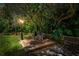 Private backyard seating area with lush landscaping providing a tranquil outdoor retreat at 9905 Woodbay Dr, Tampa, FL 33626