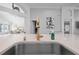 Close-up of modern kitchen faucet on light countertop at 9905 Woodbay Dr, Tampa, FL 33626