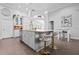 Bright kitchen featuring an island with seating, stainless appliances, and pendant lights at 9905 Woodbay Dr, Tampa, FL 33626