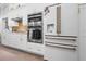 Gourmet kitchen appliances and fixtures with custom cabinetry at 9905 Woodbay Dr, Tampa, FL 33626
