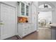 Butler's pantry featuring cupboards, drawers and tile backsplash at 9905 Woodbay Dr, Tampa, FL 33626