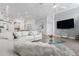 Cozy living room boasts a plush sectional sofa, modern decor, and open access to the kitchen at 9905 Woodbay Dr, Tampa, FL 33626