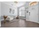 Bright living room features modern lighting, hardwood floors, and a large arched window at 9905 Woodbay Dr, Tampa, FL 33626