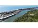 Breathtaking aerial view of a coastal town with a mix of residential and commercial properties at 13936 Harbor View Dr, Seminole, FL 33776