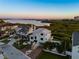 Breathtaking aerial view of the coastal home, showcasing its proximity to the water and surrounding greenery at 13936 Harbor View Dr, Seminole, FL 33776