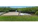 Wooden dock extends into calm waterway surrounded by lush green foliage, perfect for boating at 13936 Harbor View Dr, Seminole, FL 33776