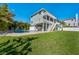 Beautiful home featuring a backyard, pool, and a covered outdoor area at 13936 Harbor View Dr, Seminole, FL 33776