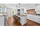 Spacious kitchen features a large island with seating and modern appliances at 13936 Harbor View Dr, Seminole, FL 33776