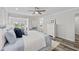 This main bedroom offers a ceiling fan, balcony access, and an ensuite bath at 13936 Harbor View Dr, Seminole, FL 33776