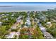 Beautiful aerial view of the neighborhood surrounded by lush greenery and water views at 2925 W Alline Ave, Tampa, FL 33611