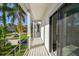 Picturesque balcony showcasing neighborhood views and offering seamless indoor-outdoor living at 1045 Jesse Ave, Safety Harbor, FL 34695