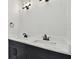 Bathroom featuring double vanity with marble countertop and modern fixtures at 1045 Jesse Ave, Safety Harbor, FL 34695