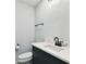 Stylish bathroom with marble countertop vanity and a modern toilet at 1045 Jesse Ave, Safety Harbor, FL 34695