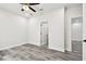Bedroom showcasing wood-look floors, white walls, recessed lighting, and modern doors at 1045 Jesse Ave, Safety Harbor, FL 34695