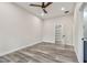 This bedroom boasts recessed lighting, wood look flooring, and a ceiling fan at 1045 Jesse Ave, Safety Harbor, FL 34695