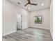 This bedroom offers wood look flooring, neutral walls, and a window at 1045 Jesse Ave, Safety Harbor, FL 34695