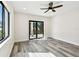 Bonus room with wood-look floors, recessed lighting, and access to outdoor balcony at 1045 Jesse Ave, Safety Harbor, FL 34695