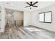 Hallway with wood-look floors, recessed lighting, and stairs at 1045 Jesse Ave, Safety Harbor, FL 34695
