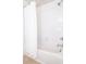 Clean and functional bathroom with a shower-tub and white tile at 10943 Verawood Dr, Riverview, FL 33579