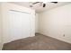 Neutral bedroom featuring carpet flooring and a double door closet at 10943 Verawood Dr, Riverview, FL 33579