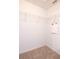 Walk-in closet with shelving and neutral carpet flooring at 10943 Verawood Dr, Riverview, FL 33579