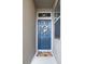 A welcoming blue front door adorned with a floral wreath and a 'HOME' doormat at 10943 Verawood Dr, Riverview, FL 33579