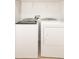 Laundry room featuring a white washer and dryer at 10943 Verawood Dr, Riverview, FL 33579