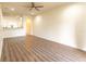 Spacious living room featuring wood flooring and an open floor plan at 10943 Verawood Dr, Riverview, FL 33579