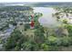 Beautiful aerial view showcasing home location near a scenic lake and lush landscapes at 1204 Joe Henry Wheeler Dr, Dover, FL 33527