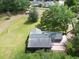 Aerial view of a home with a large yard and mature trees at 1204 Joe Henry Wheeler Dr, Dover, FL 33527